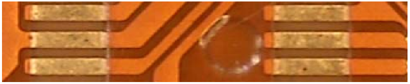 圖 1-3 不正常的金手指(金面有紅褐色斑點)